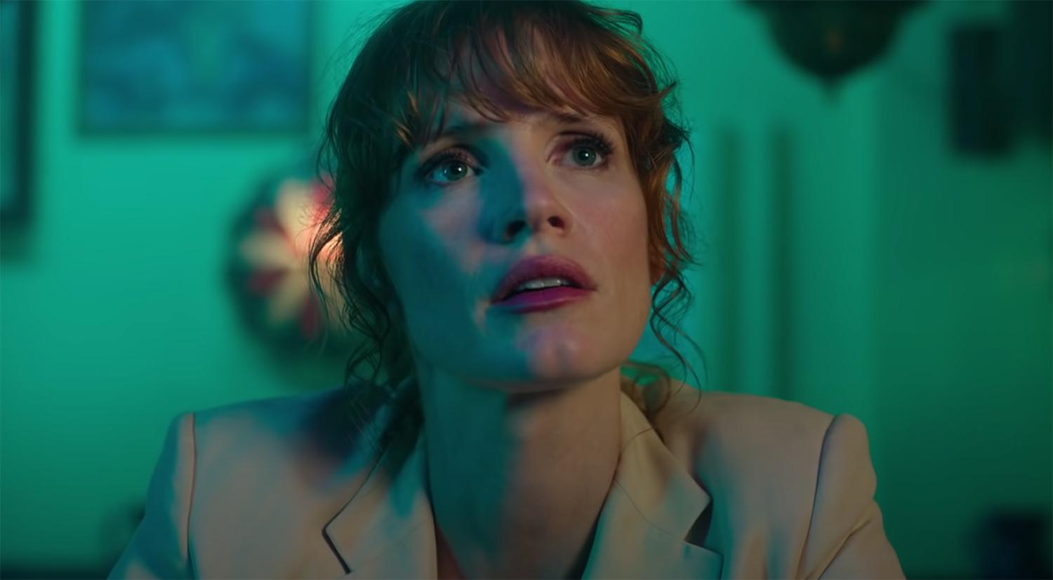 Jessica Chastain looks up at a monitor.