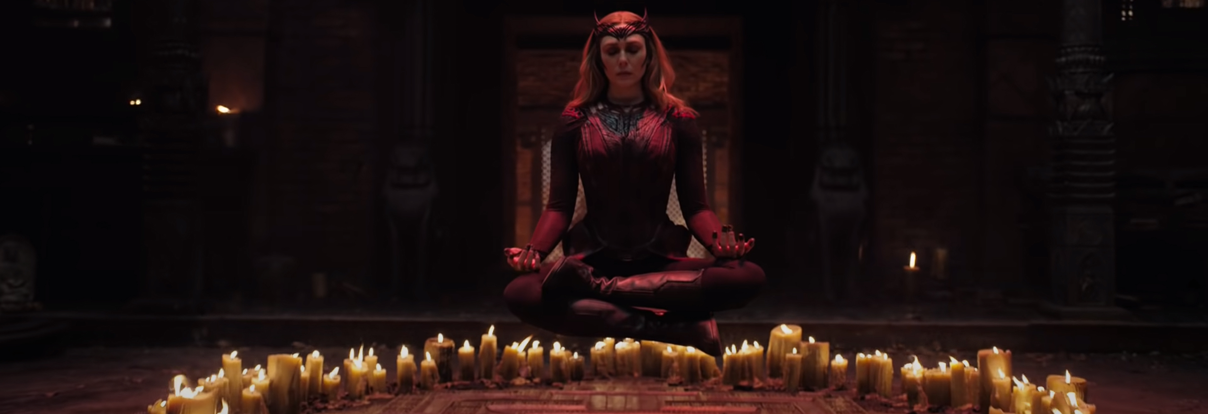 Wanda/Scarlet Witch floating over some candles