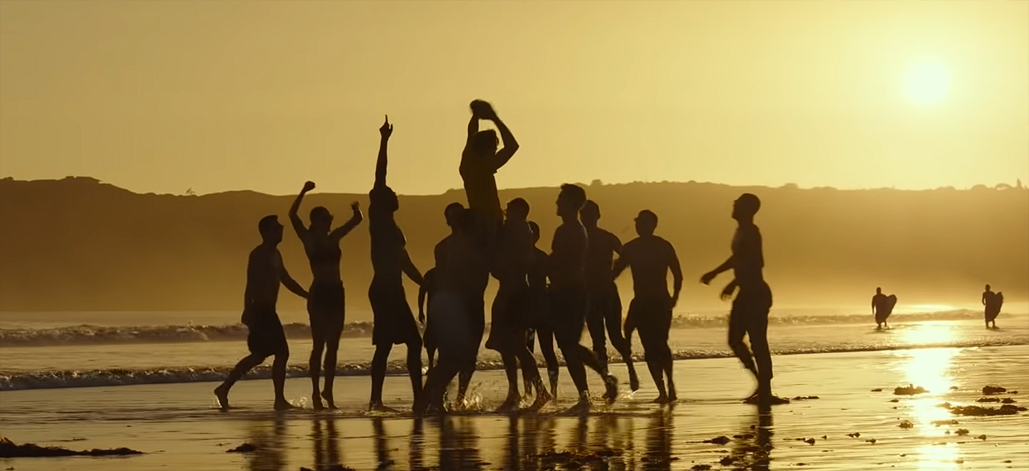 Playing football on the beach