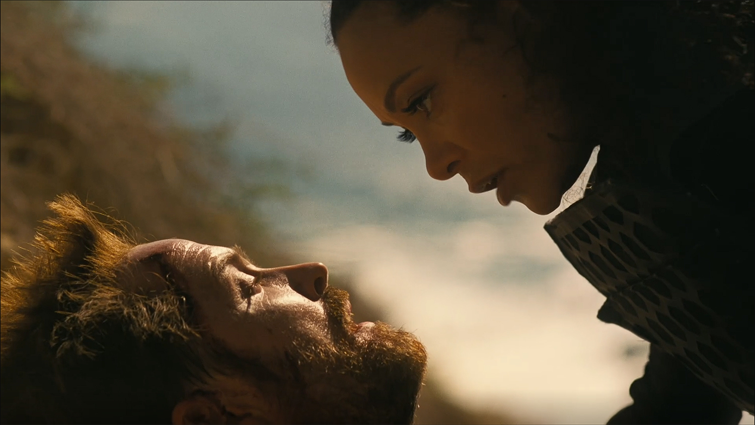 Maeve comforts Caleb as he lies possible dying.