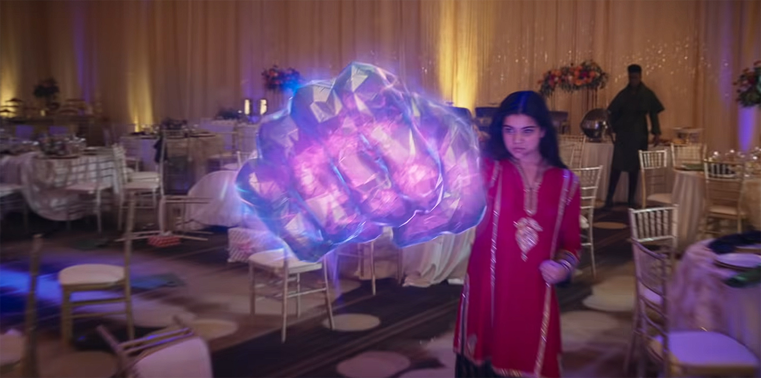 Kamala creates a giant glowing fist.