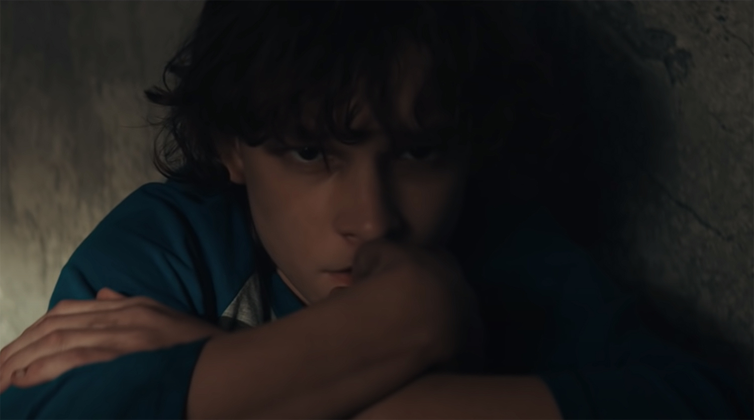 Finn sits, planning his escape.