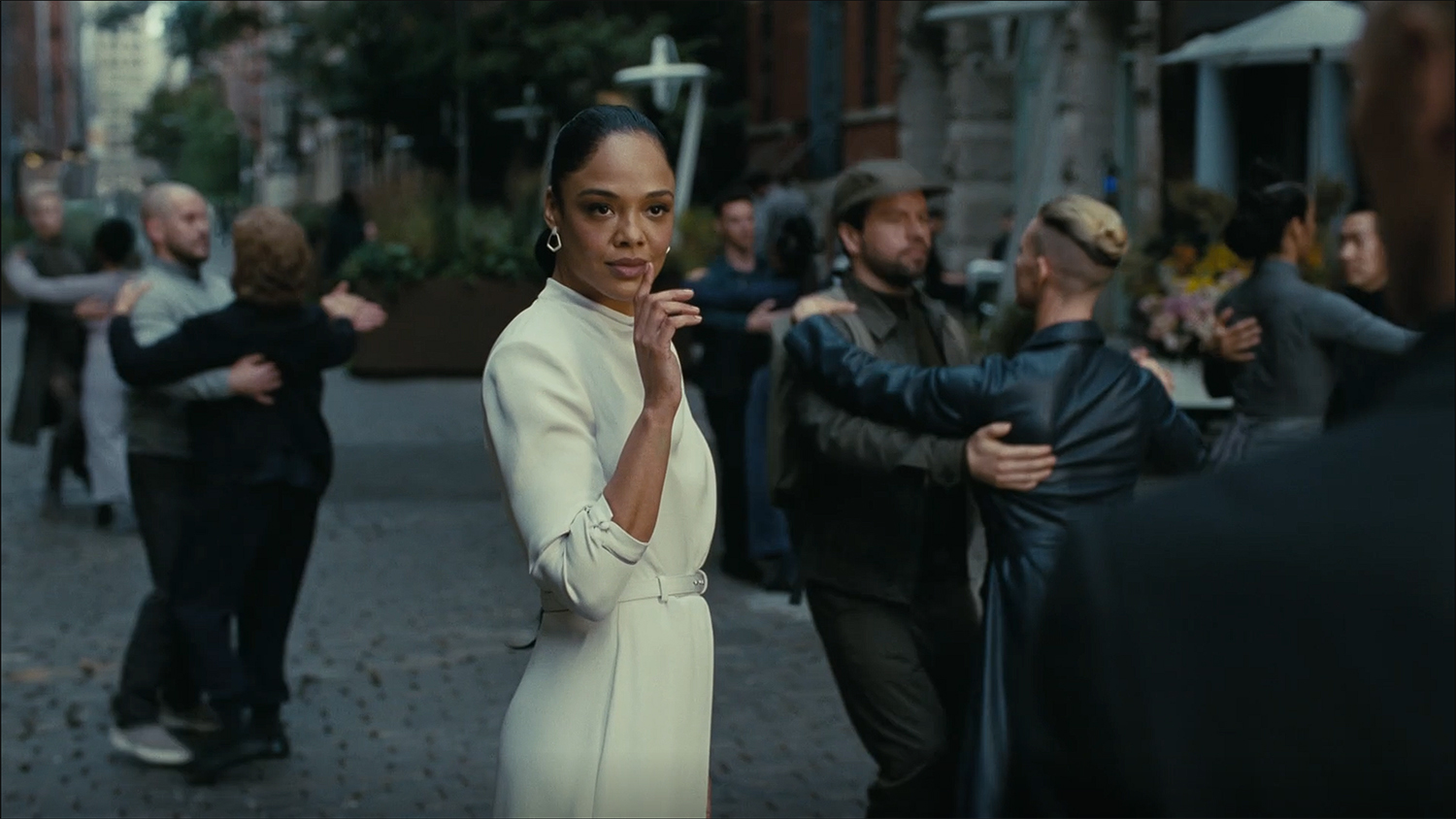 Tessa Thompson dances in the street.
