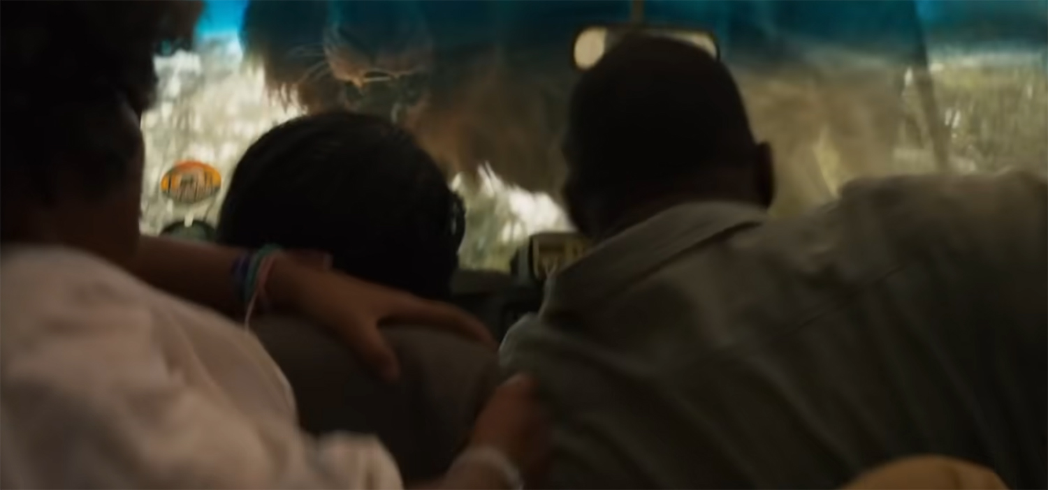 The Lion jumps on their car.