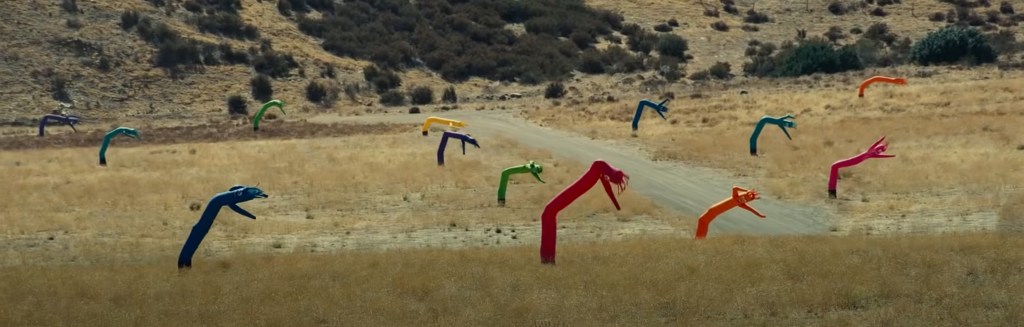 a field of waking inflatable men