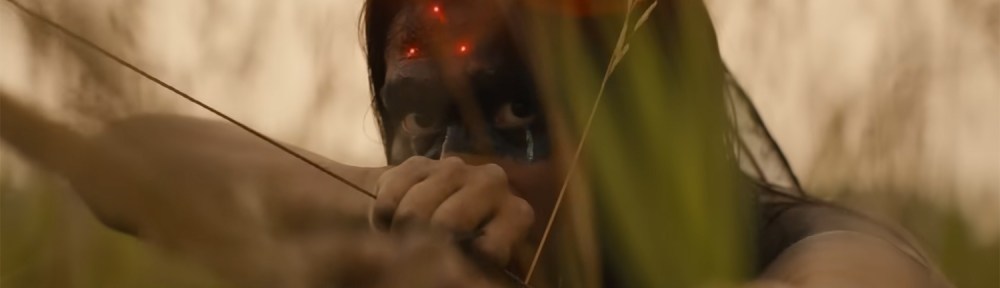 Three red dots on his forhead.