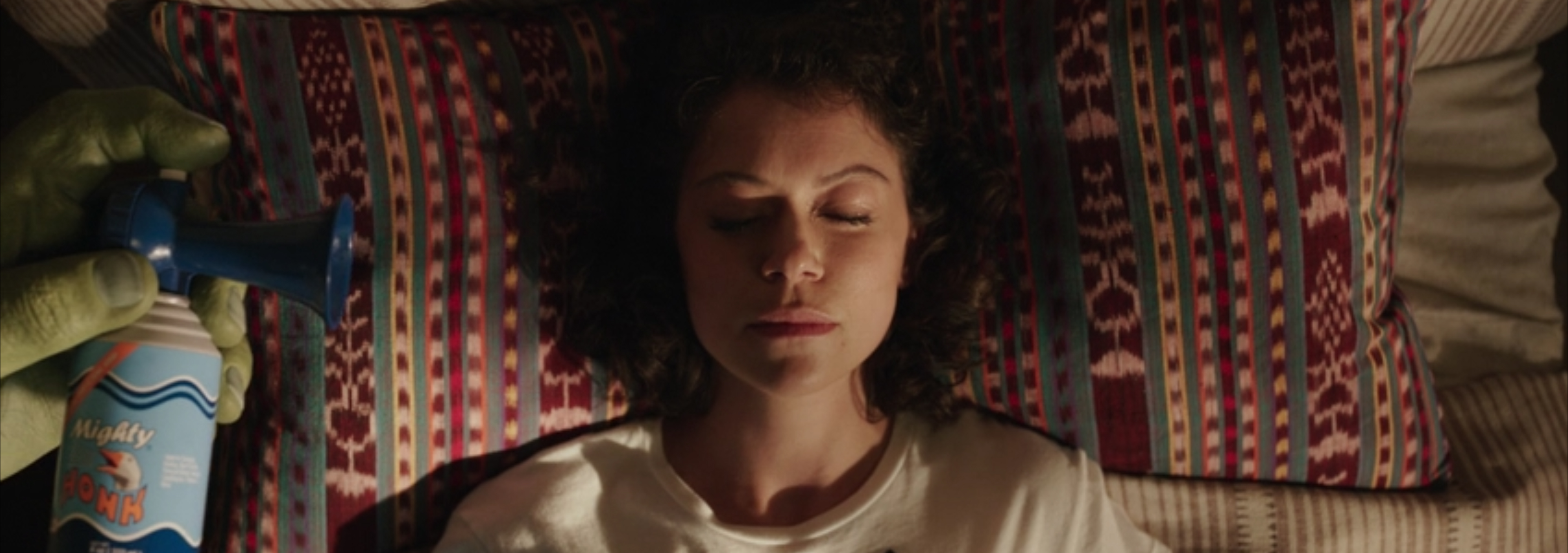 Bruce about to wake Jennifer up with a horn.