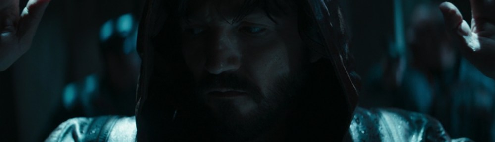 Andor has his hands up as he is accosted by Corpos.