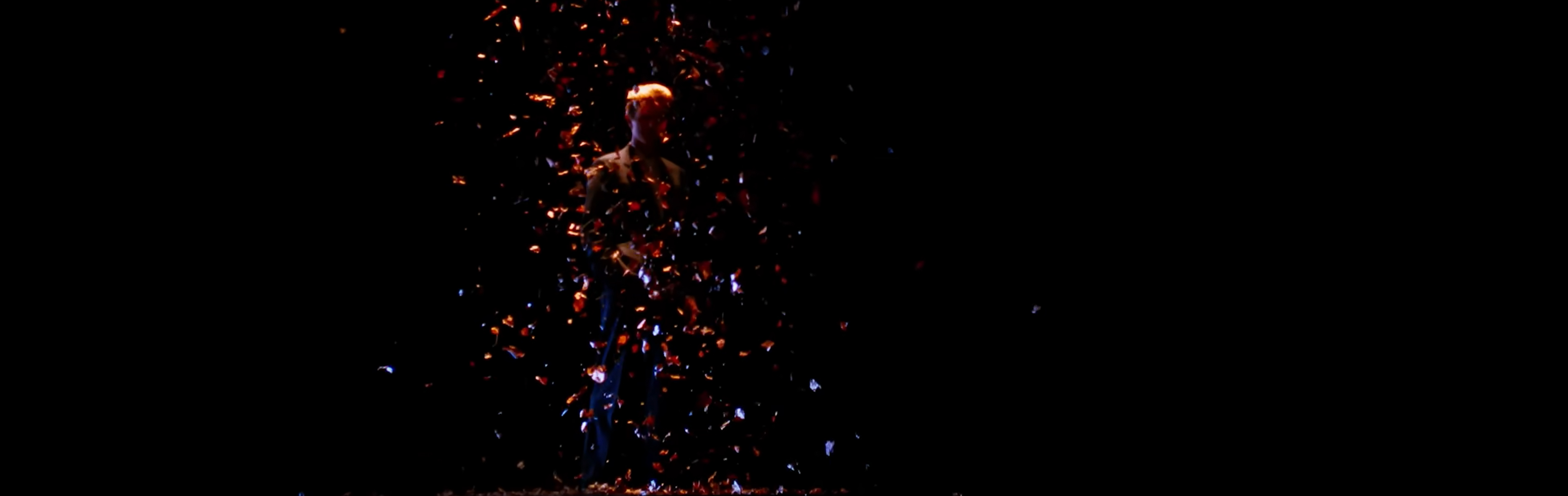 Glitter falls from the celling into Bowie.