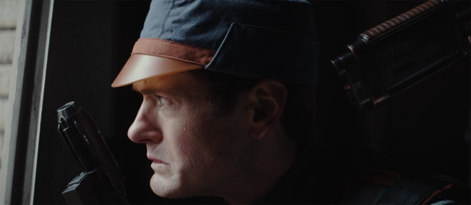 Syril gets held up form behind.