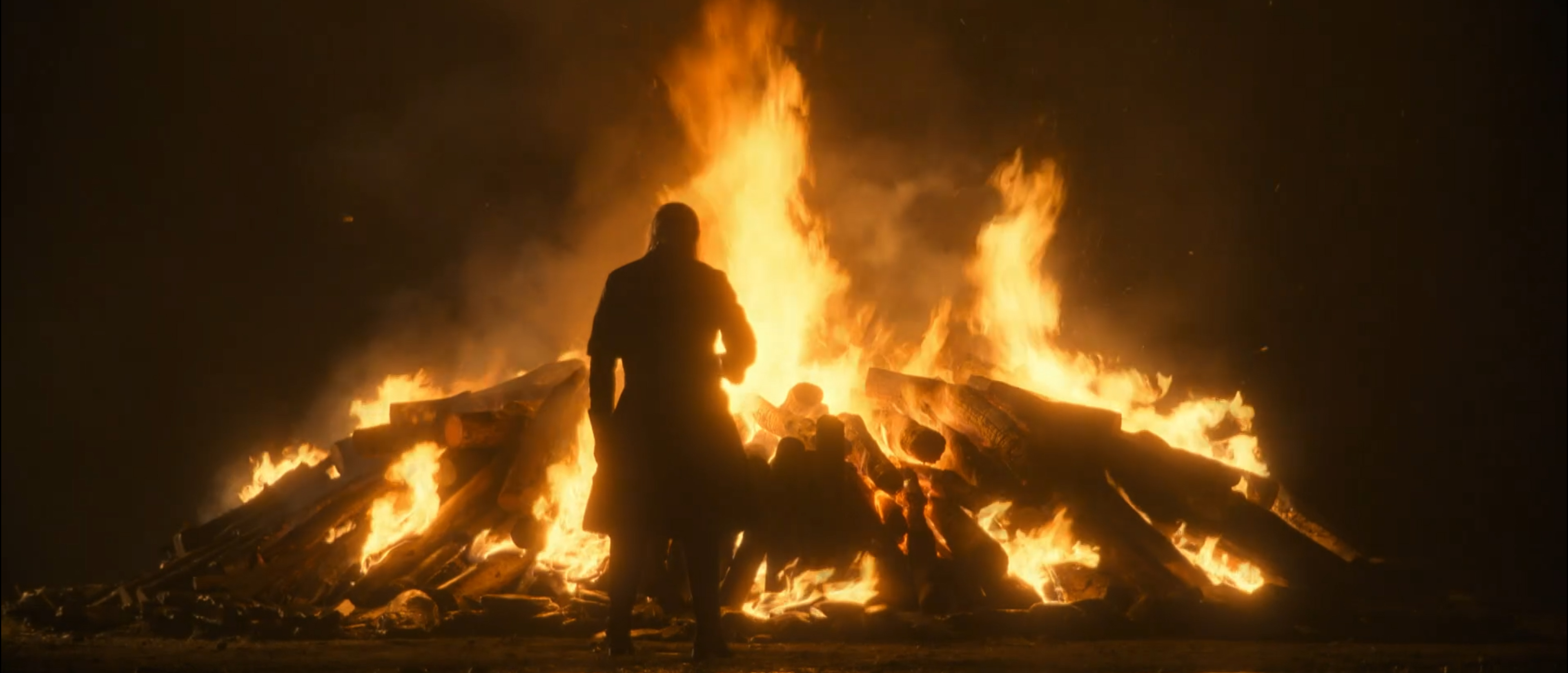 King Viserys I Targaryen stares at a fire.
