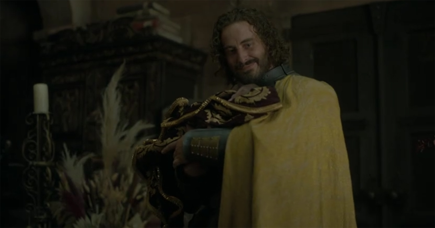 Ser Harwin Strong’s (Ryan Corr) holds the baby.