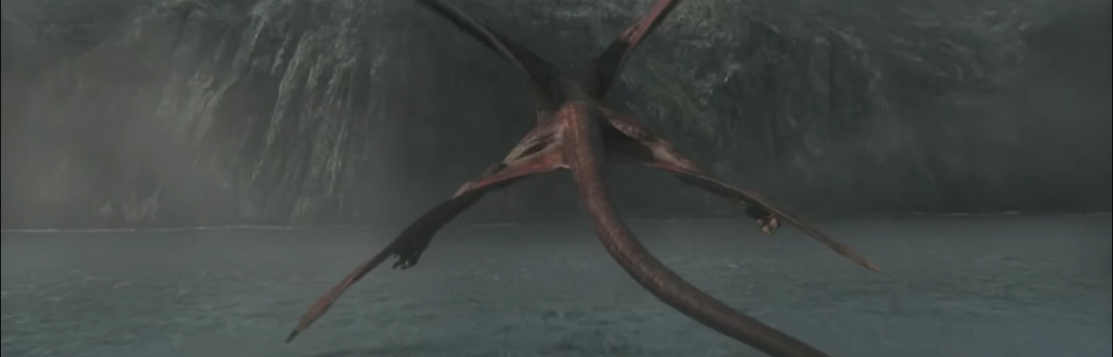 A dragon flies on top of the water.