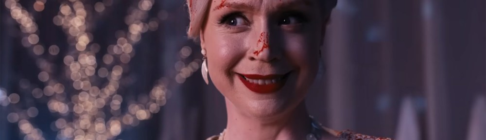 Gwendoline Christie smiles covered in blood