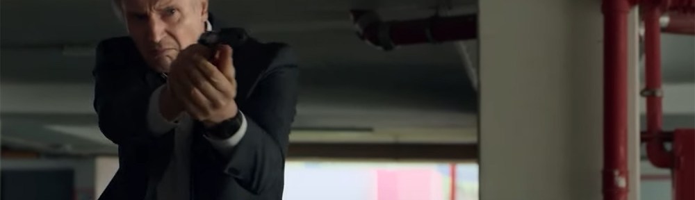 Liam Neeson firers his gun.