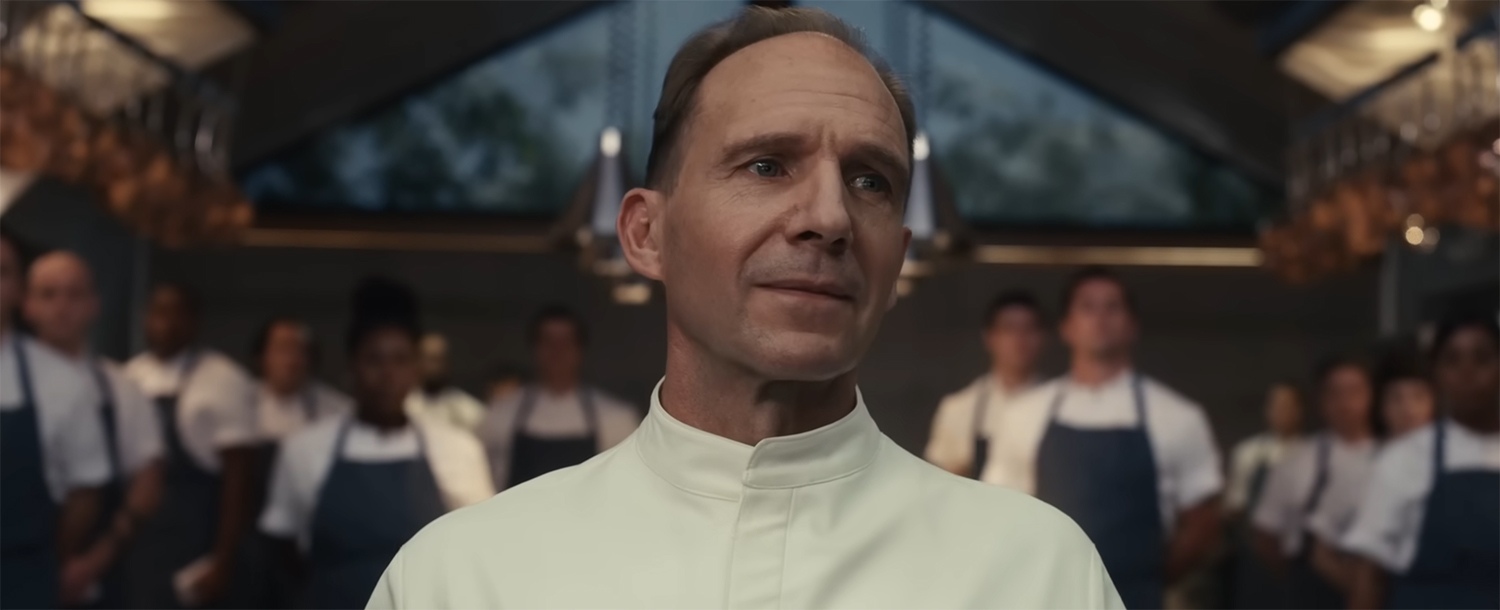 Ralph Fiennes capturing all attention in the room with a clap.