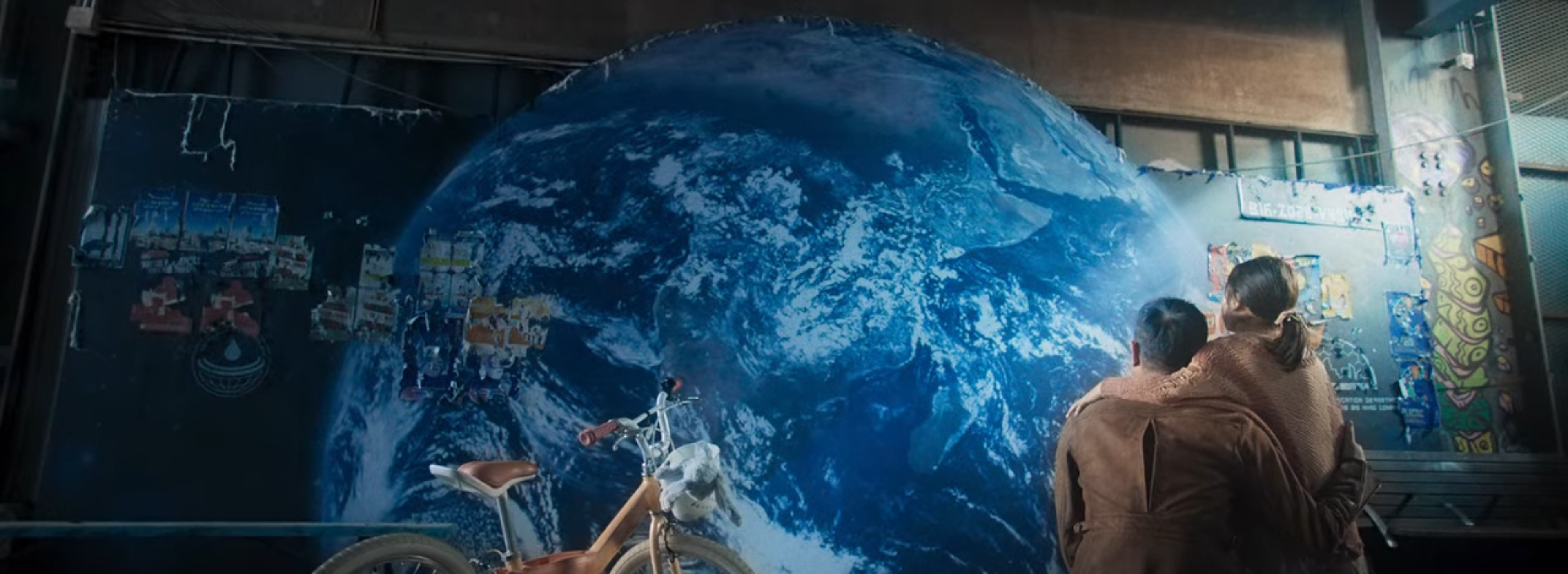 Looking up at a painted rendition of what Earth used to look like.