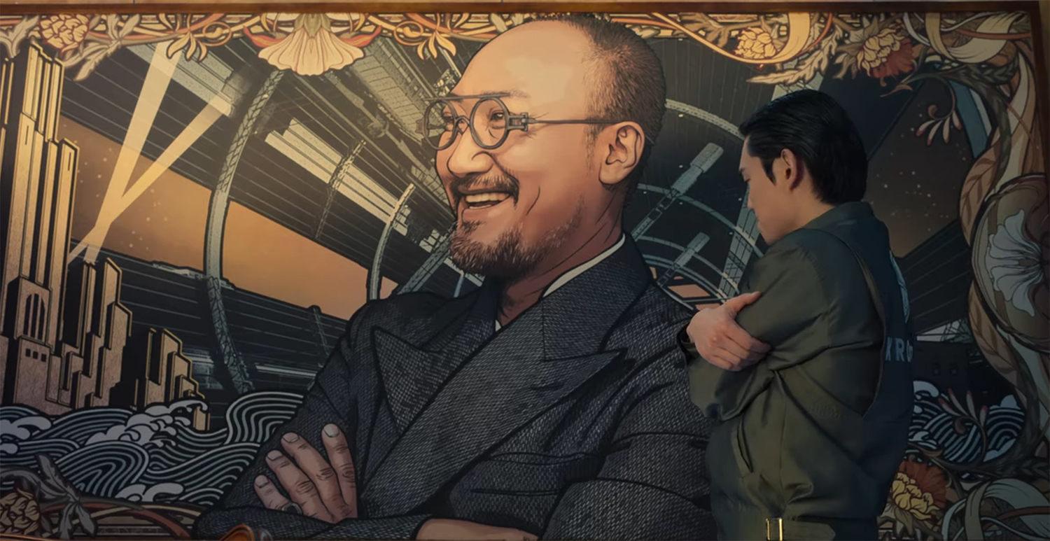 Sang-Hoon looks at a painting of the Chairman.