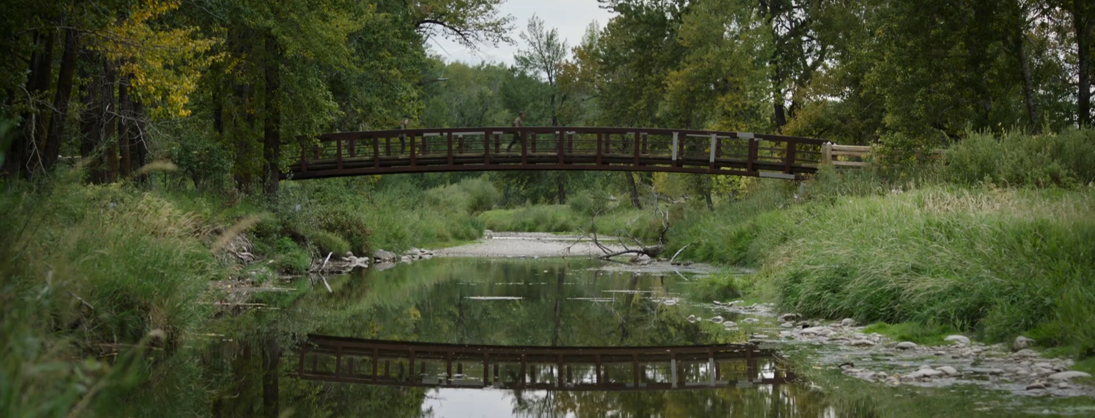 Walking over a bridge.