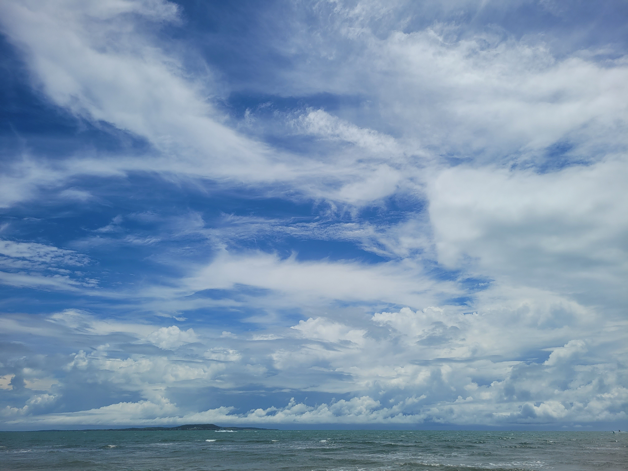 Clouods roll like waves in the sky.
