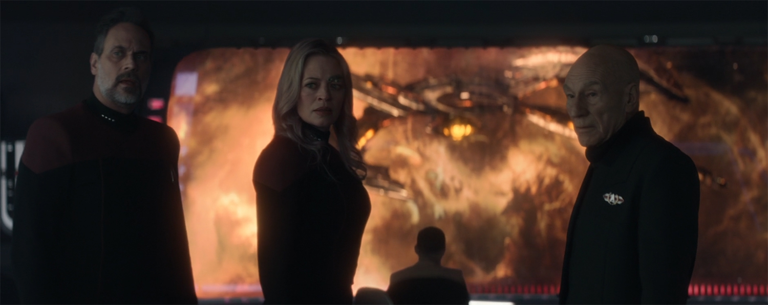 Shaw, Seven, and Picard look at Jack.