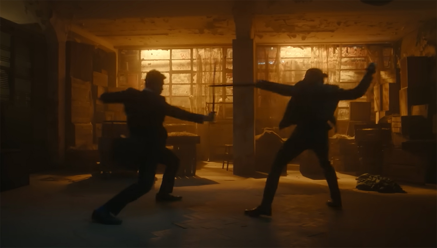 Lockwood fights off an adversary with a golden sword