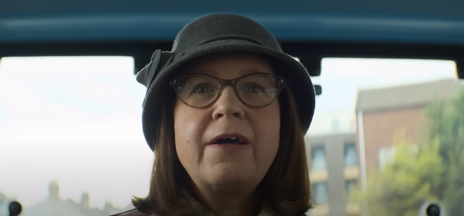 A woman watches the Bus Dance.