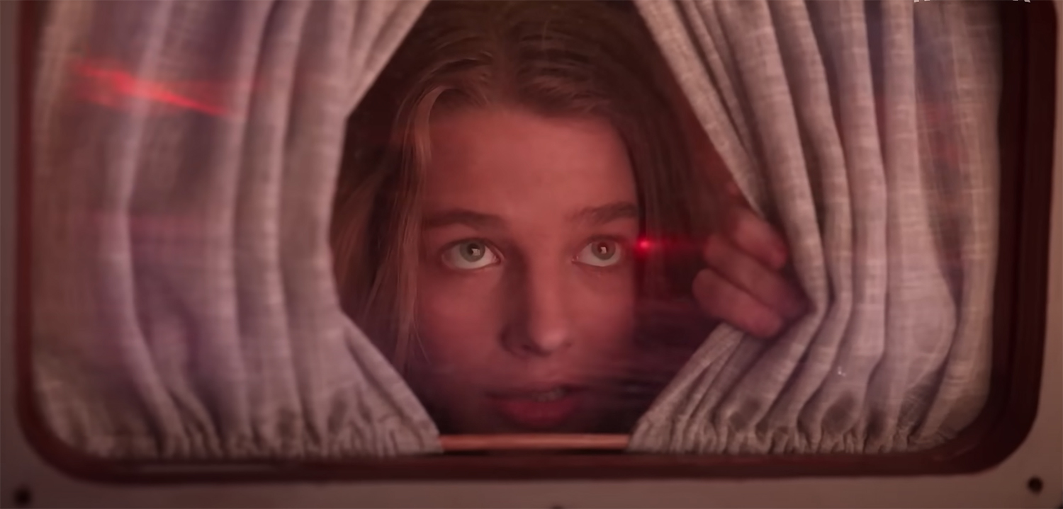 Jessica Watson looks out the window at a red sky.