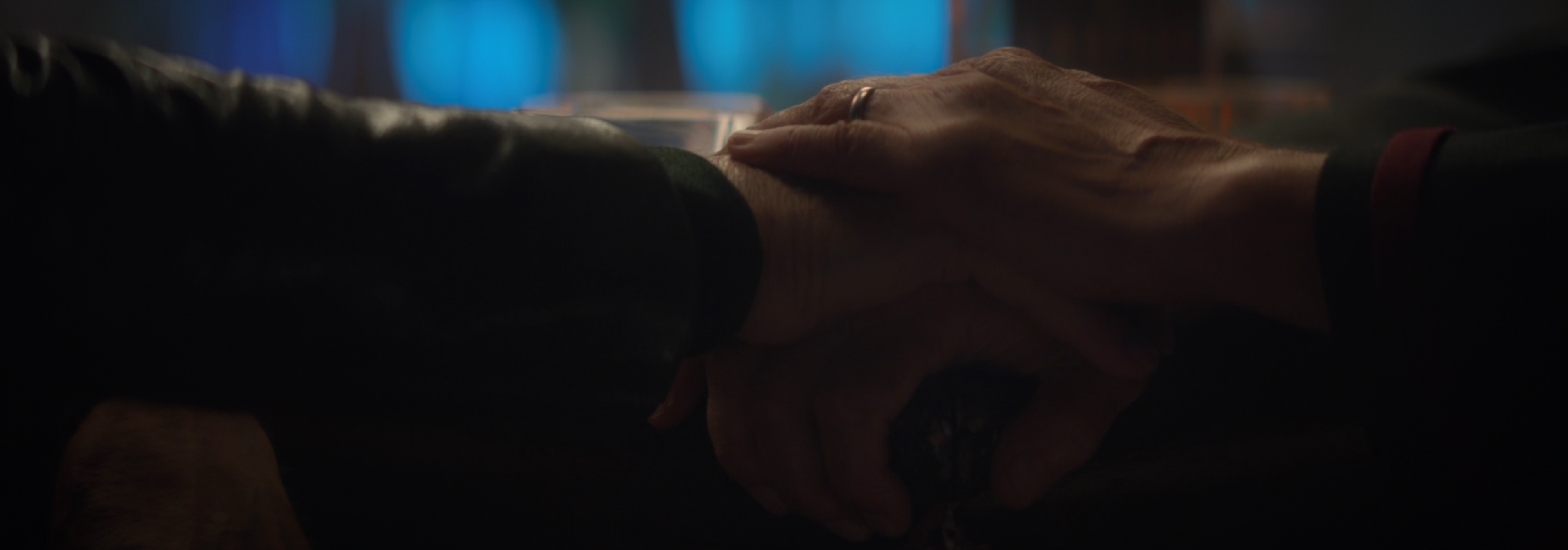 Picard's hand on Riker's.