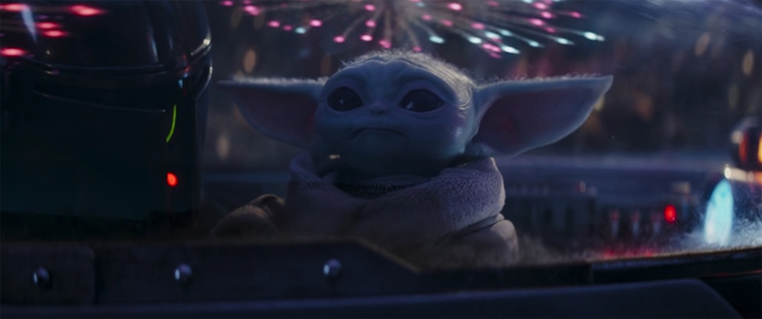 Grougo watches fireworks from the cockpit.