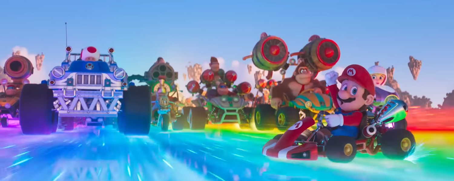 The gang ride the rainbow road.