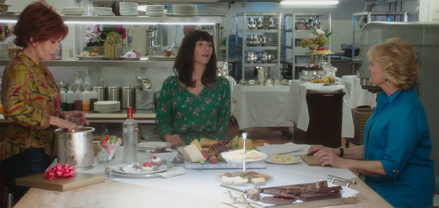 Women discuss the book over cheese and wine.