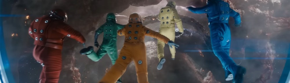 Bouncing around in multi-coloured space suits.