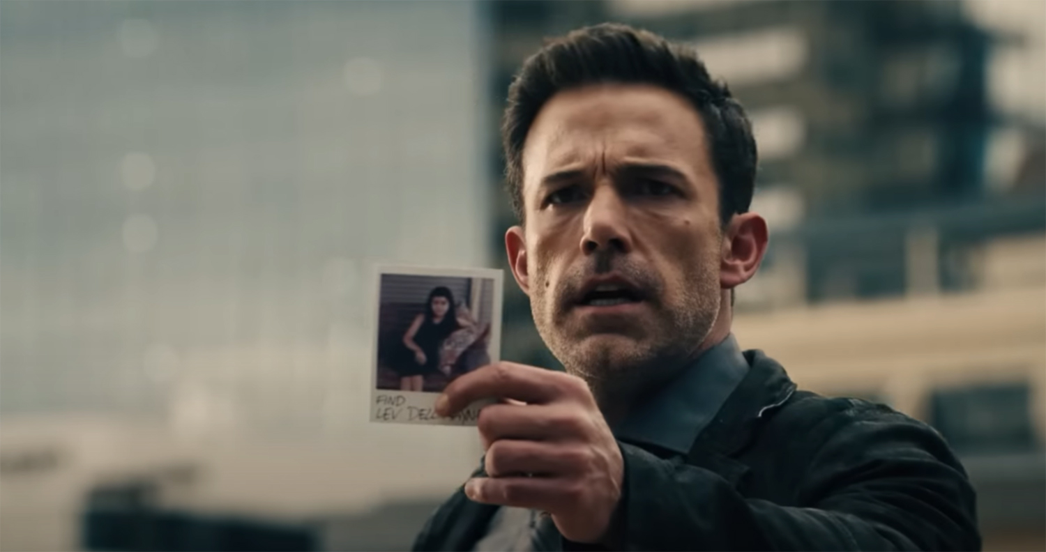 Ben holds up the phot of his missing daughter.