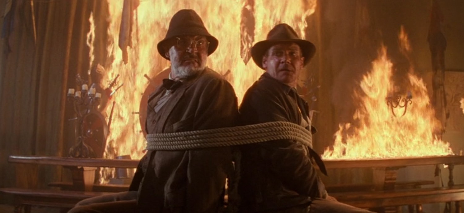 Indy and his dad tied up with flames.