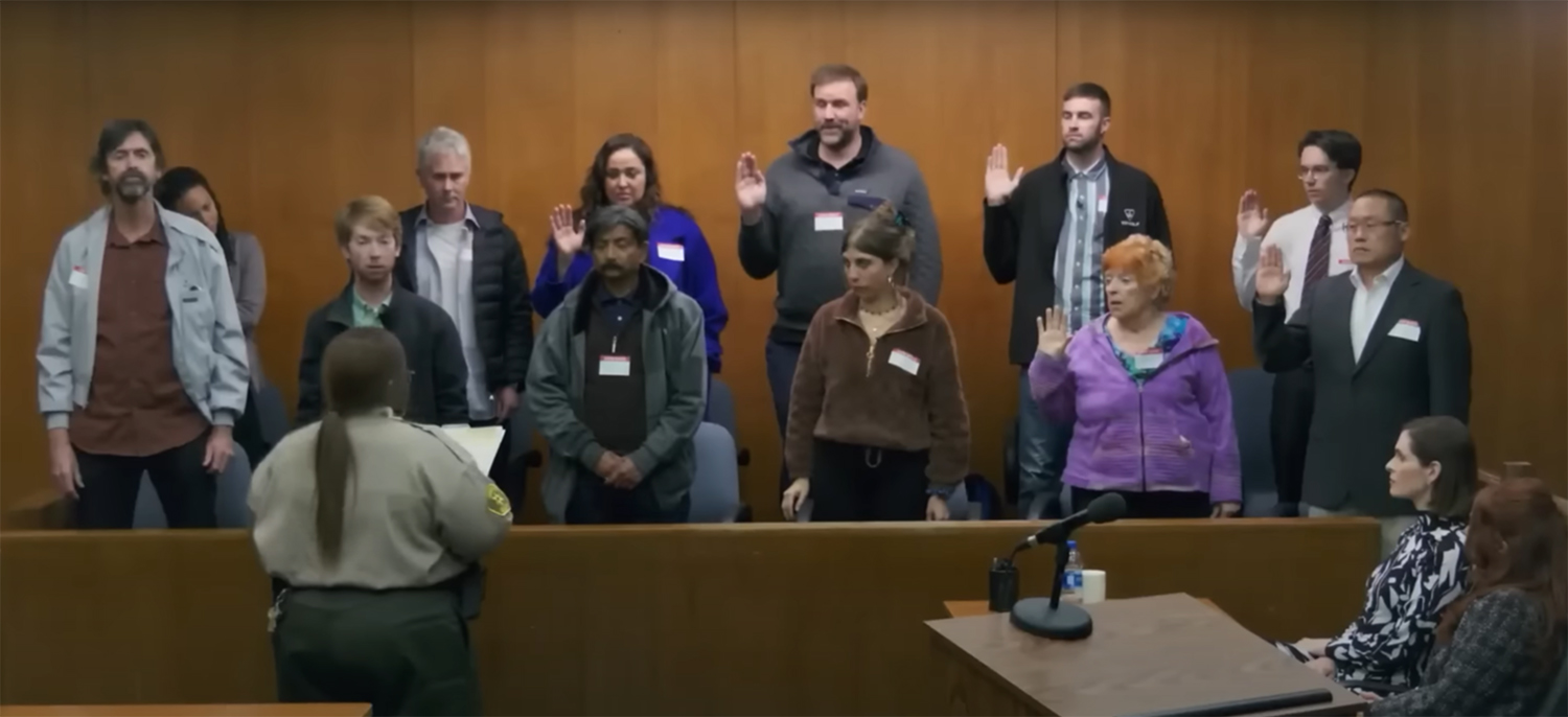 The jury is sworn in.