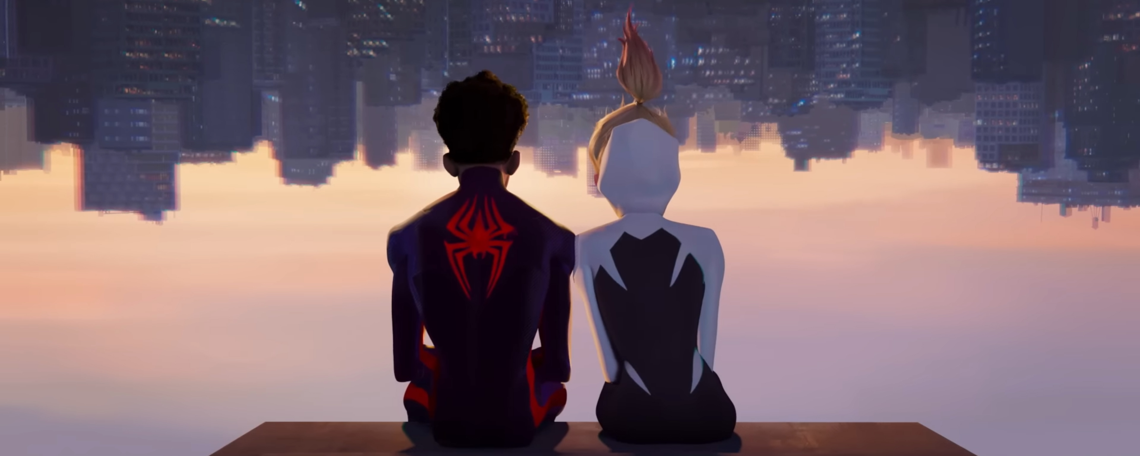 Gwen and Miles sit upside down looking at the sky line of New York.