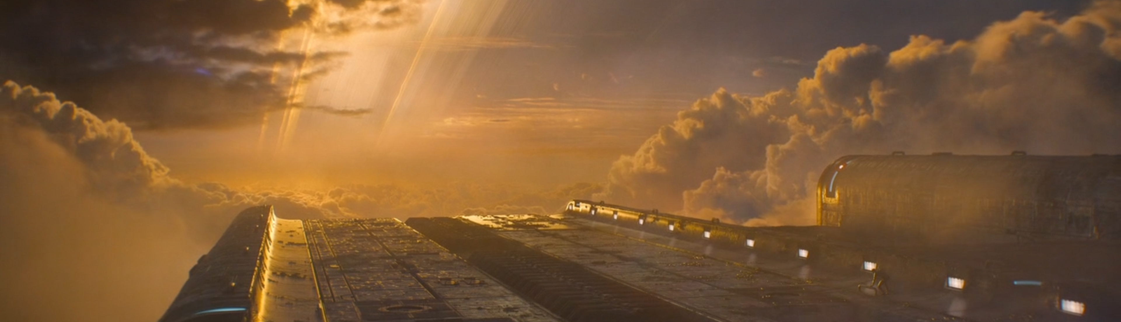 A sun sets over a ring world.