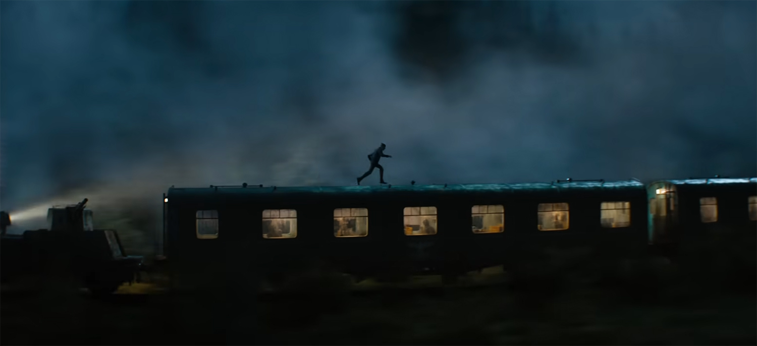 Indy running on top of a train.