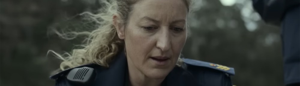 Senior Sergeant Dulcie Collins reviews the body.