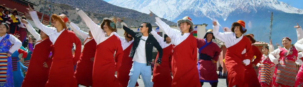 Dancing in front of mountains.