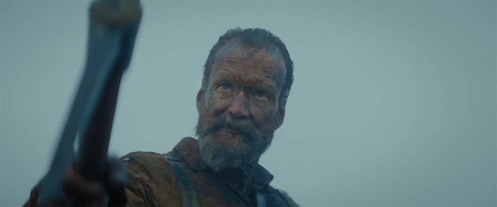 Aatami Korpi threatens with a pickaxe.