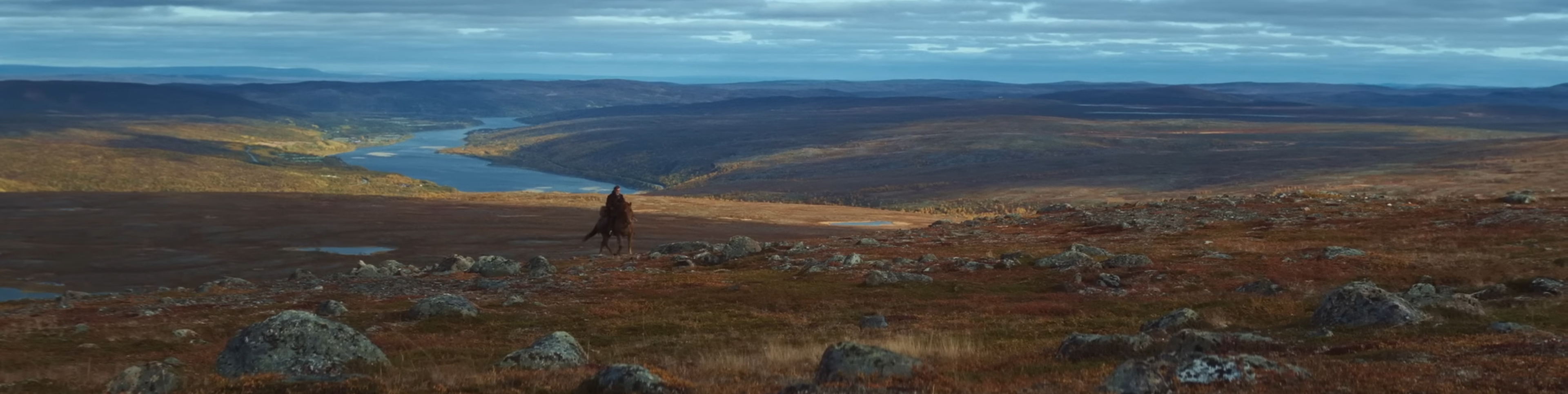 A horse rides over the Lapland countryside.