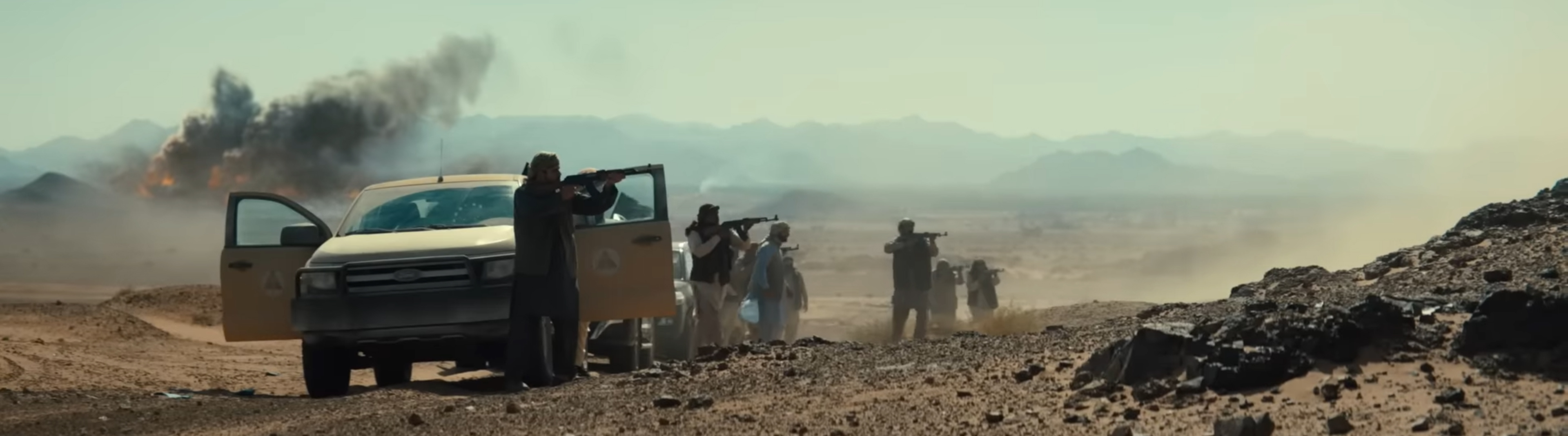 Fighters line up with guns.