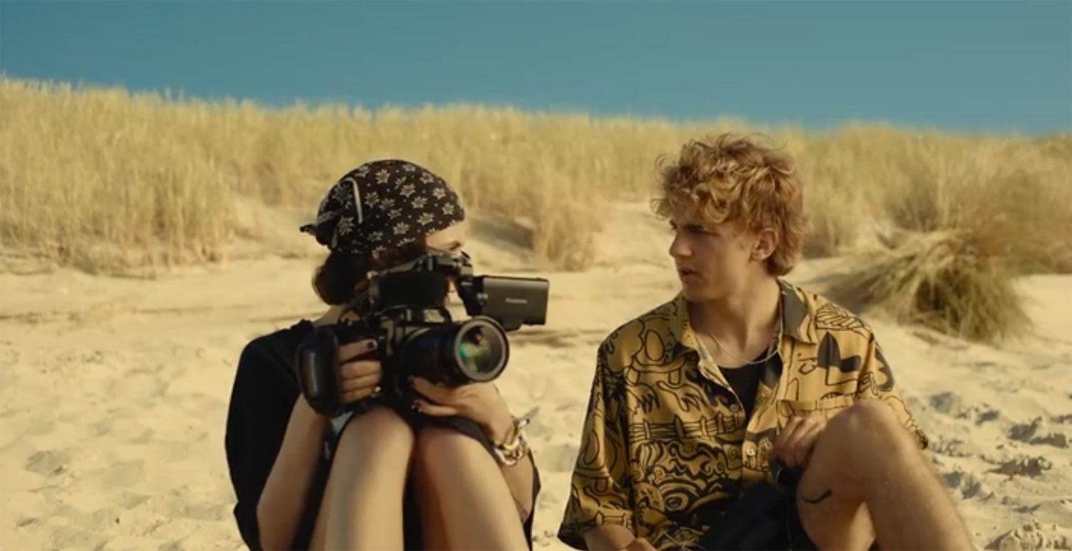 Lena and Niko on a beach.