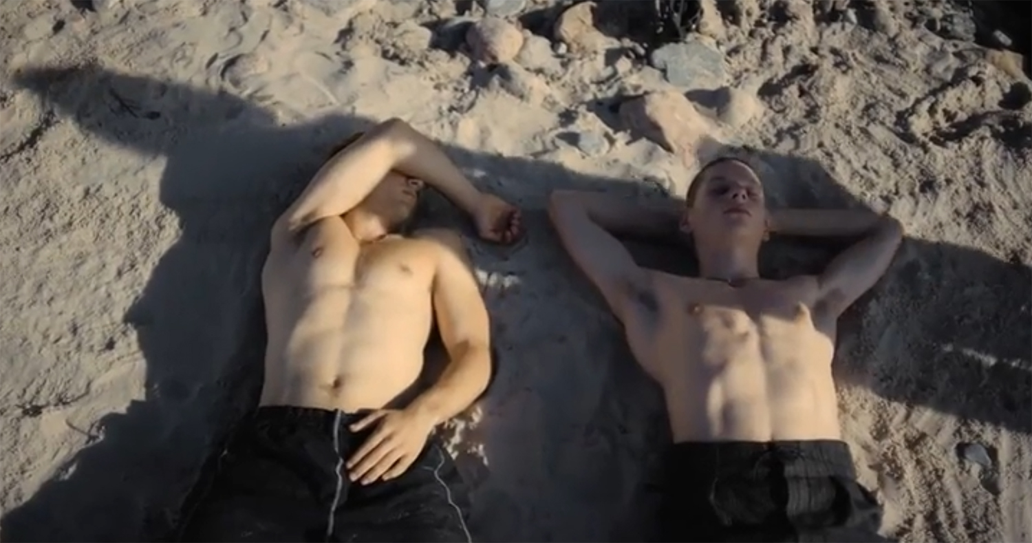 Niko and Igor asleep on the beach.