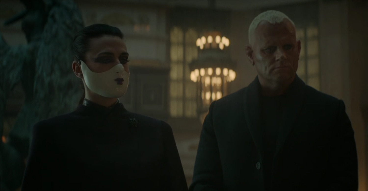 The Adjudicator with their mask.