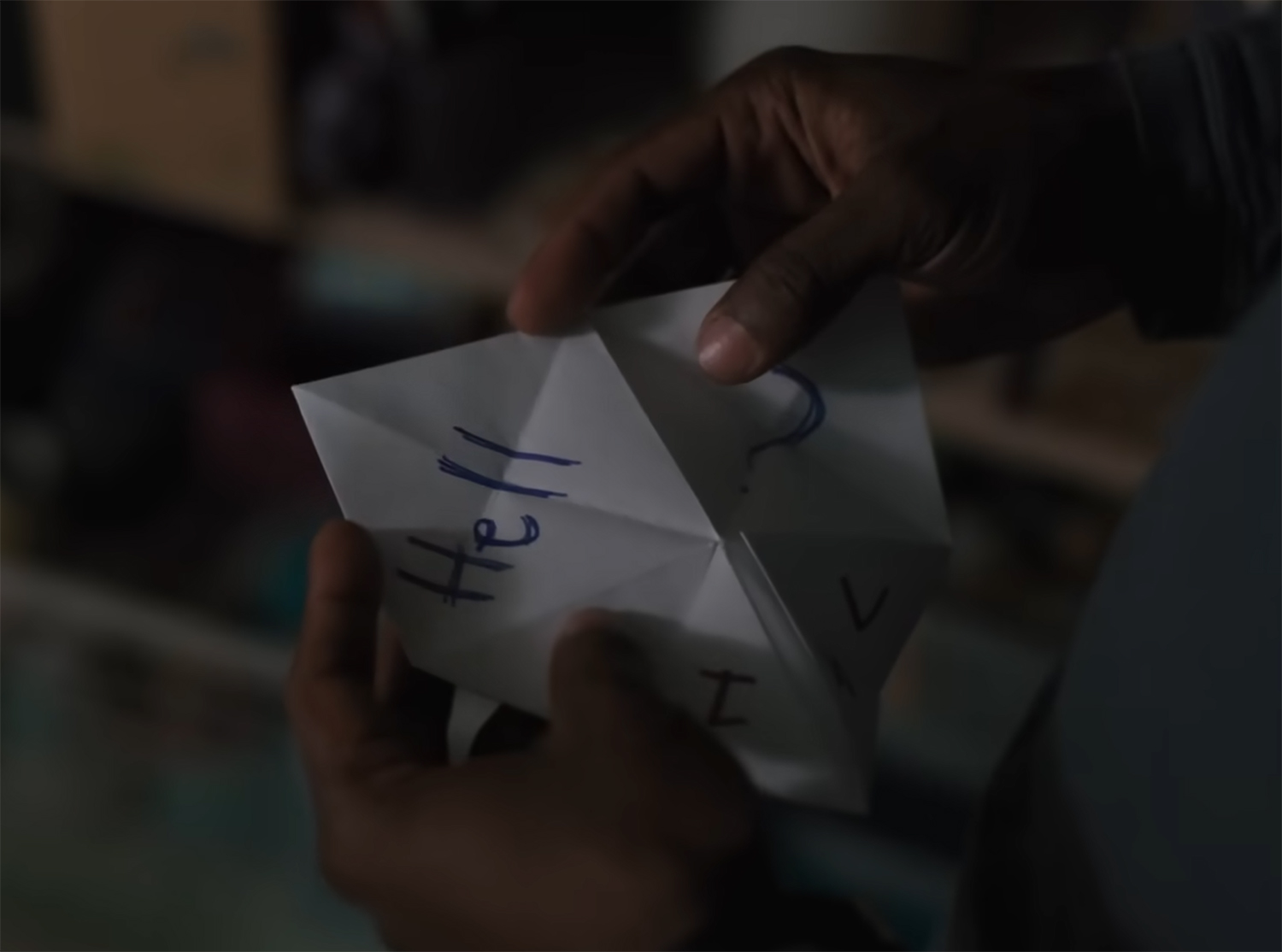 A paper puzzle reveals the word Hell.