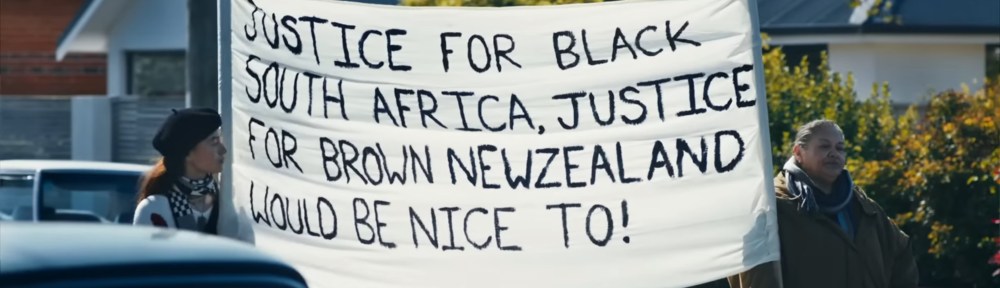 A sign that says "Justice for Black South Africa, Justice for Brown New Zealand would be nice to!"