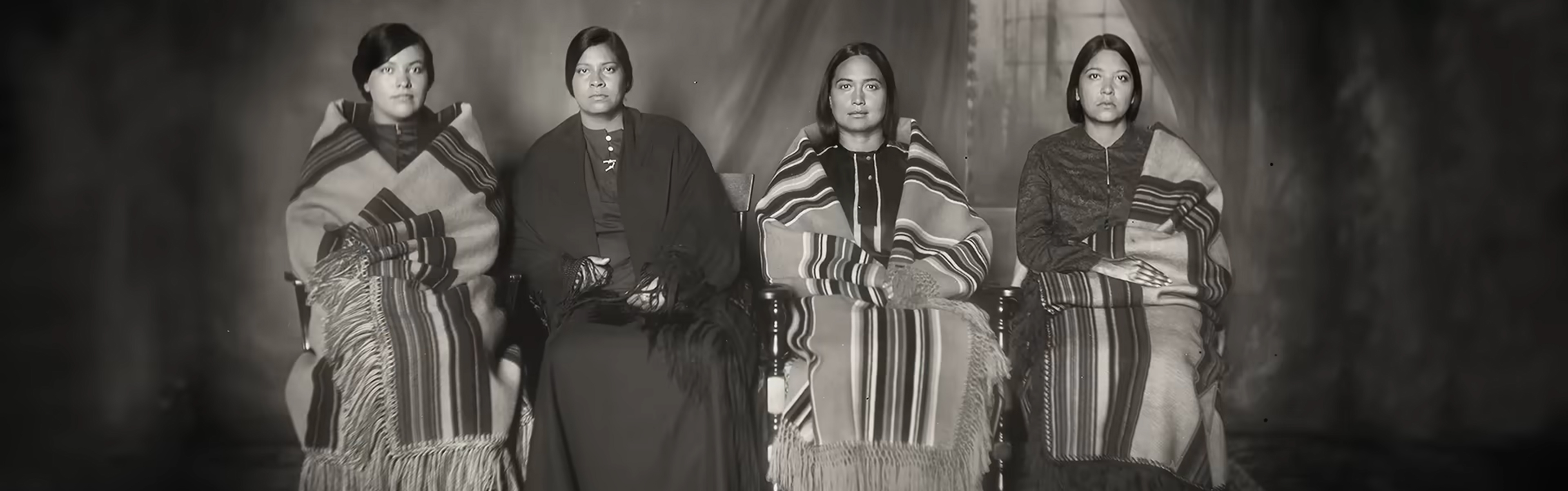 The sisters take a photo.